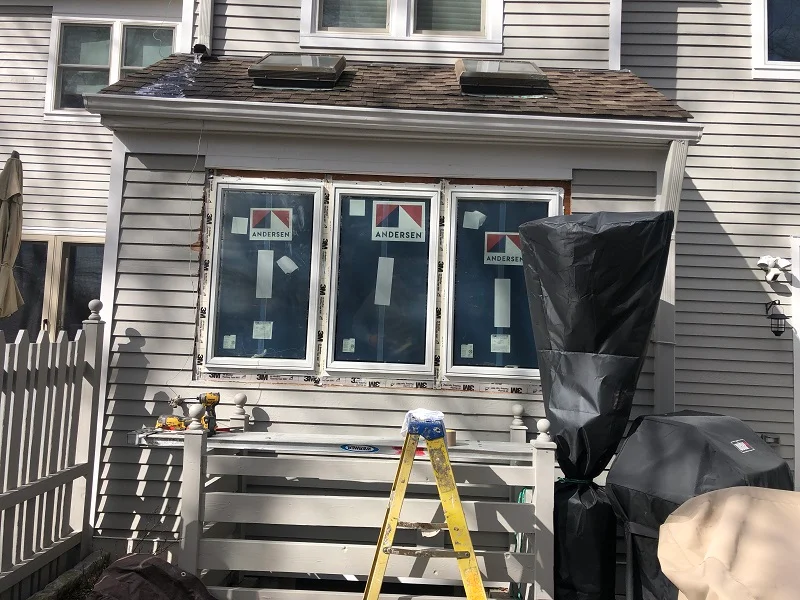 Exterior picture of Andersen 400 Series casement windows being installed in a Scarsdale condo